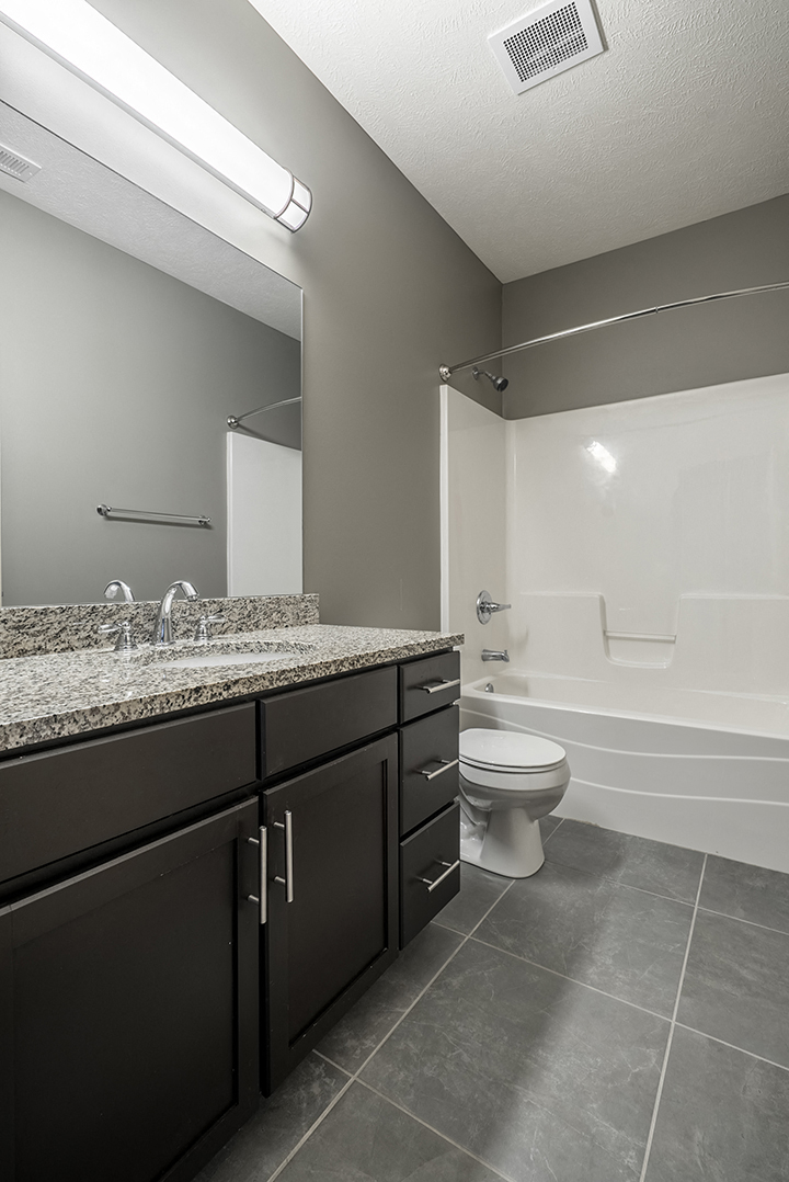 Interiors- Granite countertops and stand-up shower in Bathroom at the Villas of Omaha at Butler Ridge in Omaha Nebraska