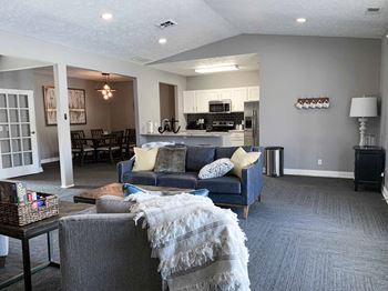 apartment clubhouse with a couch and a table