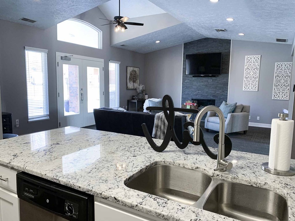 a kitchen with a sink and a counter top