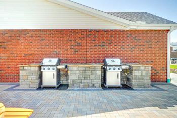 Two outdoor grilling stations with stone counters, perfect for grilling up your favorite recipes.
