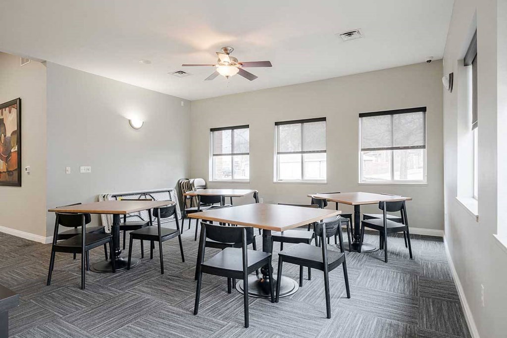 tables and chairs for guests to use in the clubhouse
