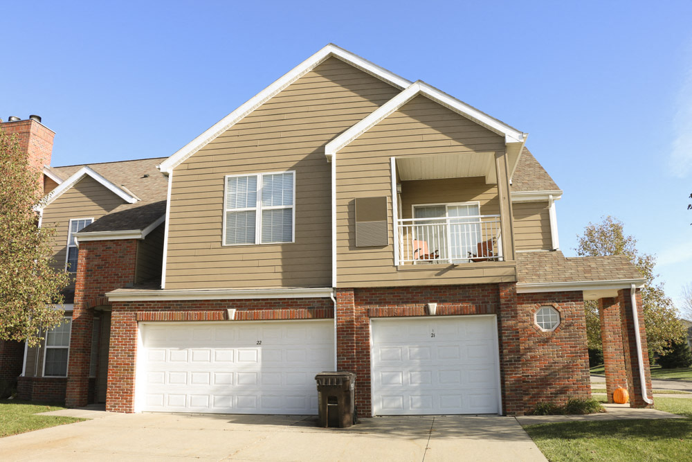 Exteriors-View of Ridge Pointe Villas townhomes with attached 1 and 2 car garages