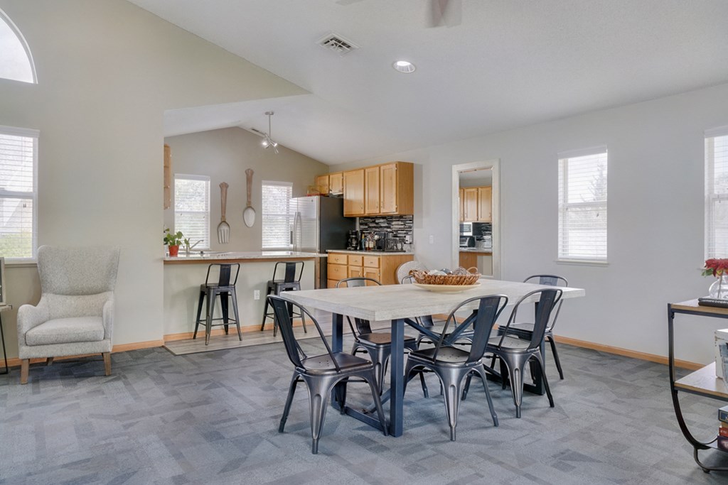 Dining space and community kitchen in the clubhouse at Skyline View apartments