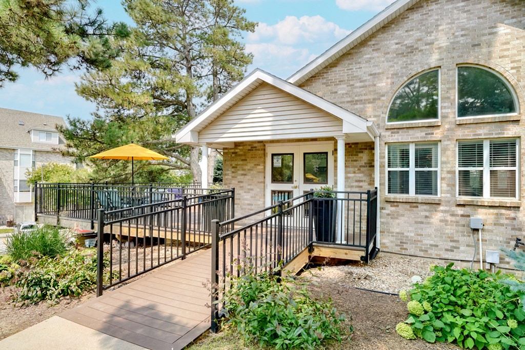 Exterior of the Skyline View clubhouse and leasing office with wraparound porch
