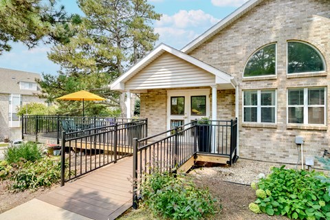 Exterior of the Skyline View clubhouse and leasing office with wraparound porch