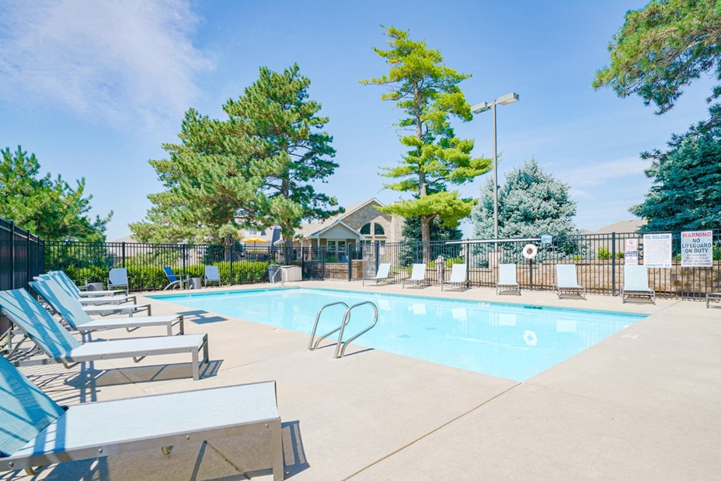 Swimming pool with lounge chairs for sunbathing