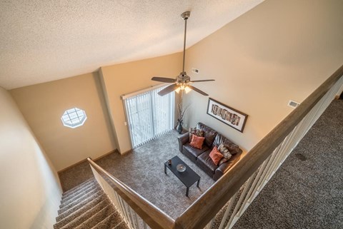 View from top loft of apartment into the living room below