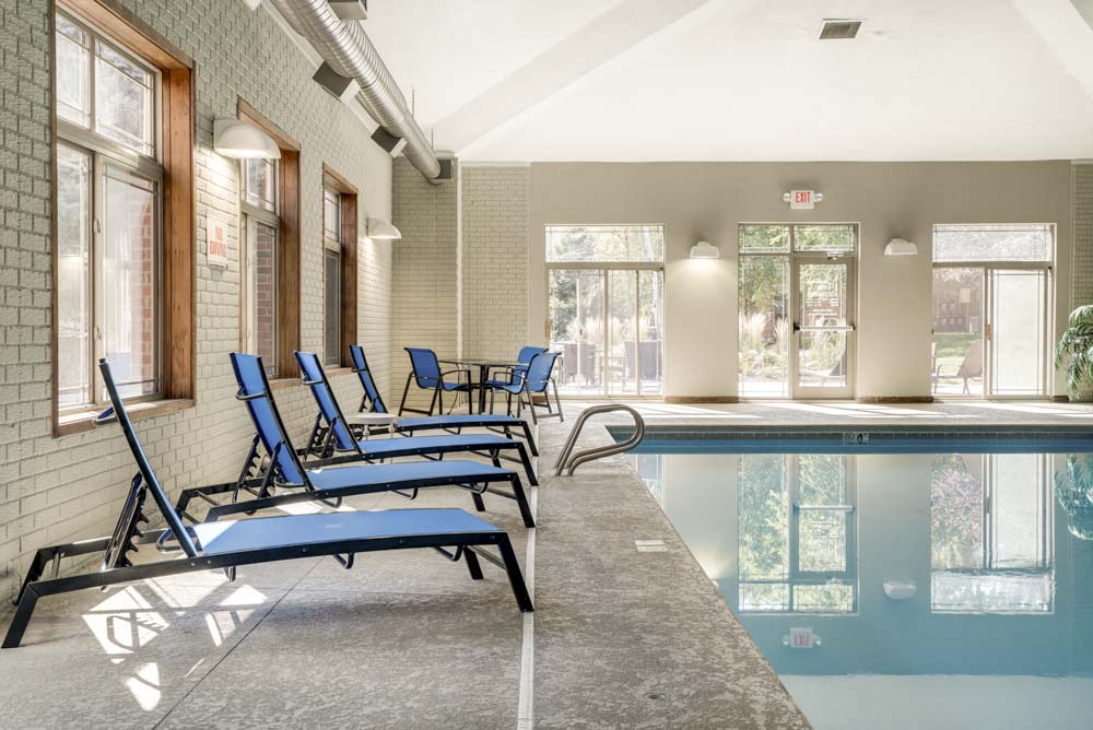 Lounge chairs next to indoor swimming pool at Southwind Villas in southwest Omaha in La Vista, NE, 68128