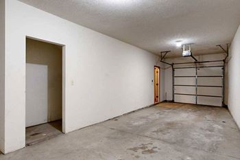 A tandem 2-car garage with under-stair storage.