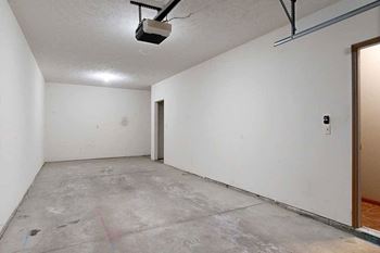 A tandem 2-car garage with under-stair storage.