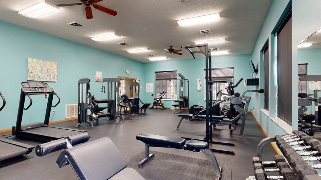 24 hour fitness center with cardio equipment and weights
