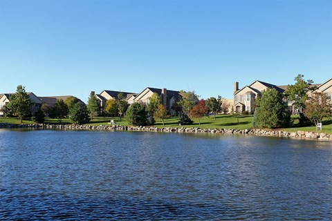 Villa buildings along a large pond
