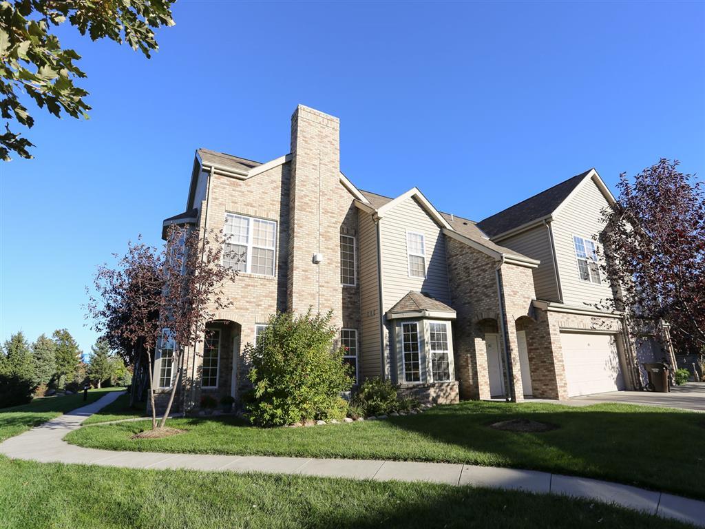 Exterior view of Stone Ridge townhomes with private entrance and attached garage