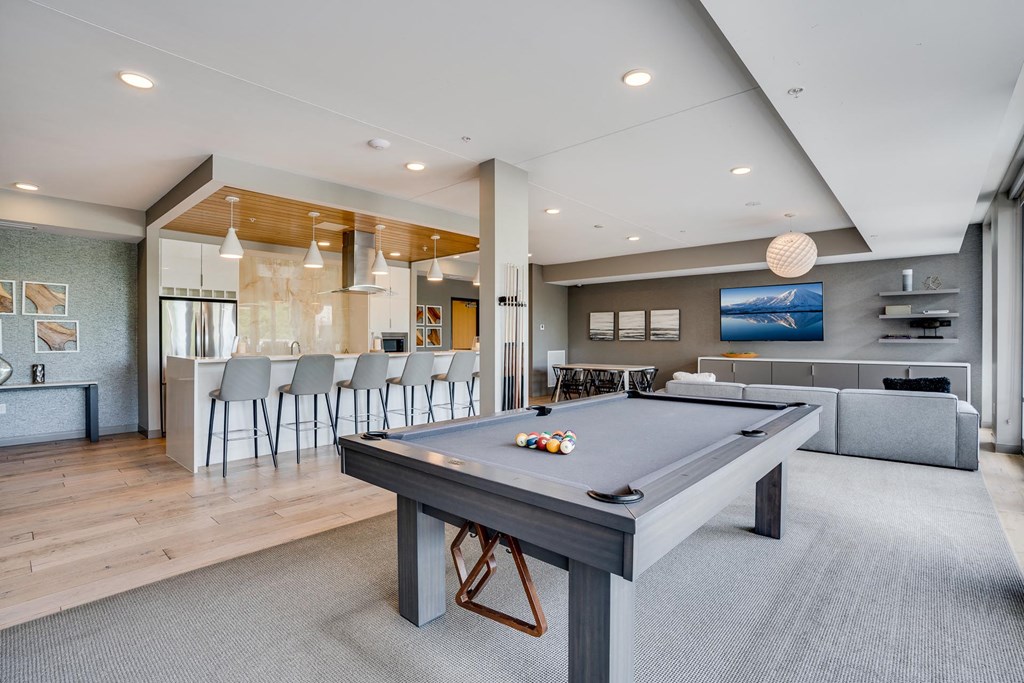 The Club Room features a pool table, big screen TV, and a gourmet kitchen