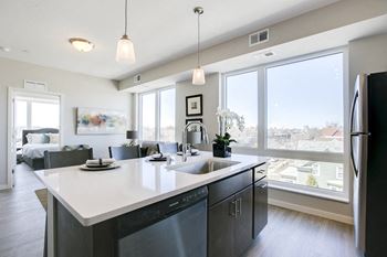 View of apartment from kitchen island at The Central apartments near downtown Minneapolis MN 55408