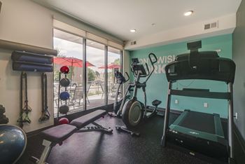 Workout gym with cardio equipment at The Central apartments near downtown Minneapolis MN 55408