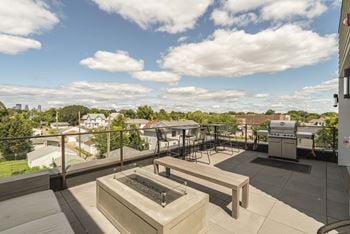 Rooftop patio and outdoor firepit at The Central apartments near downtown Minneapolis MN 55408