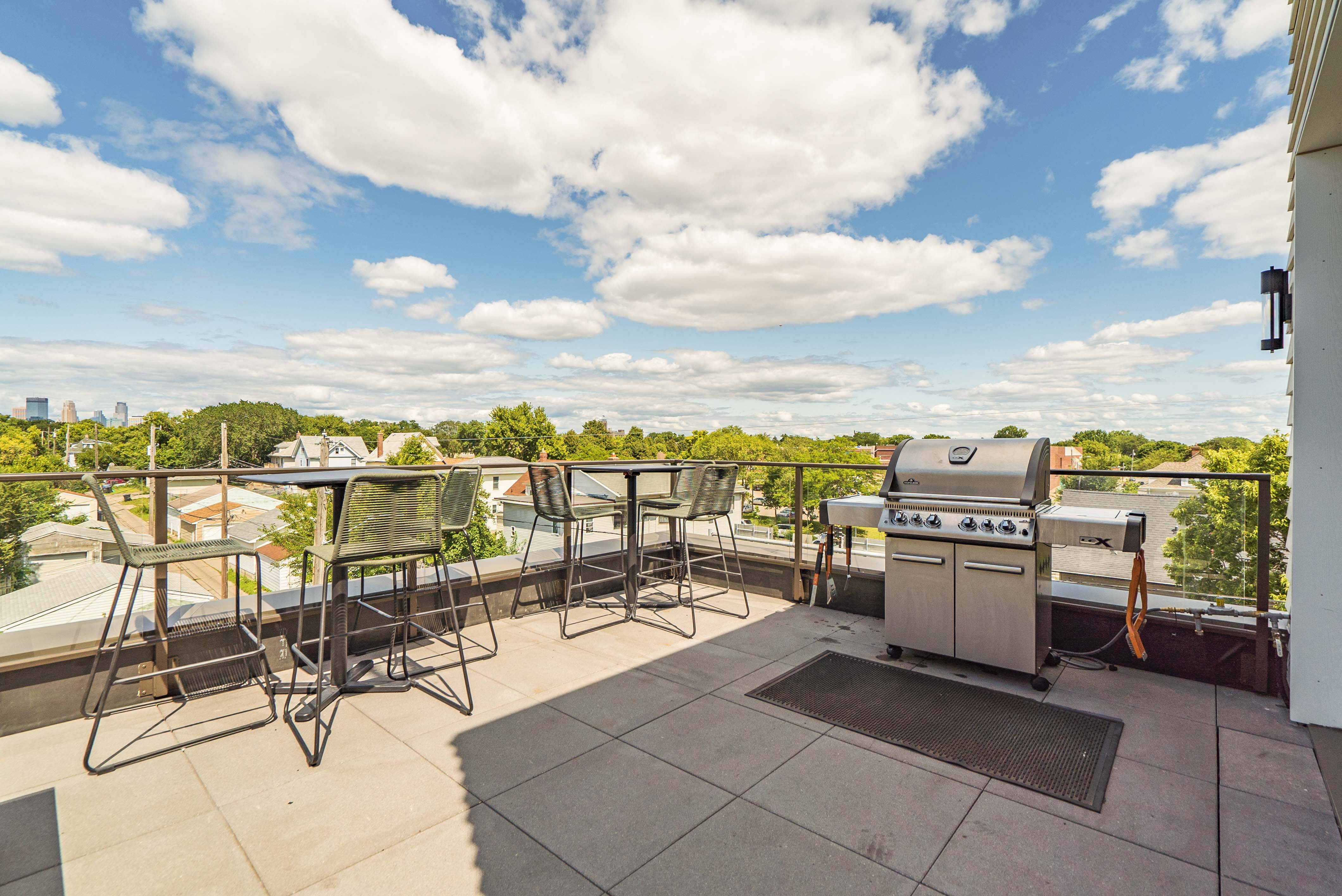 Rooftop patio and outdoor firepit at The Central apartments near downtown Minneapolis MN 55408