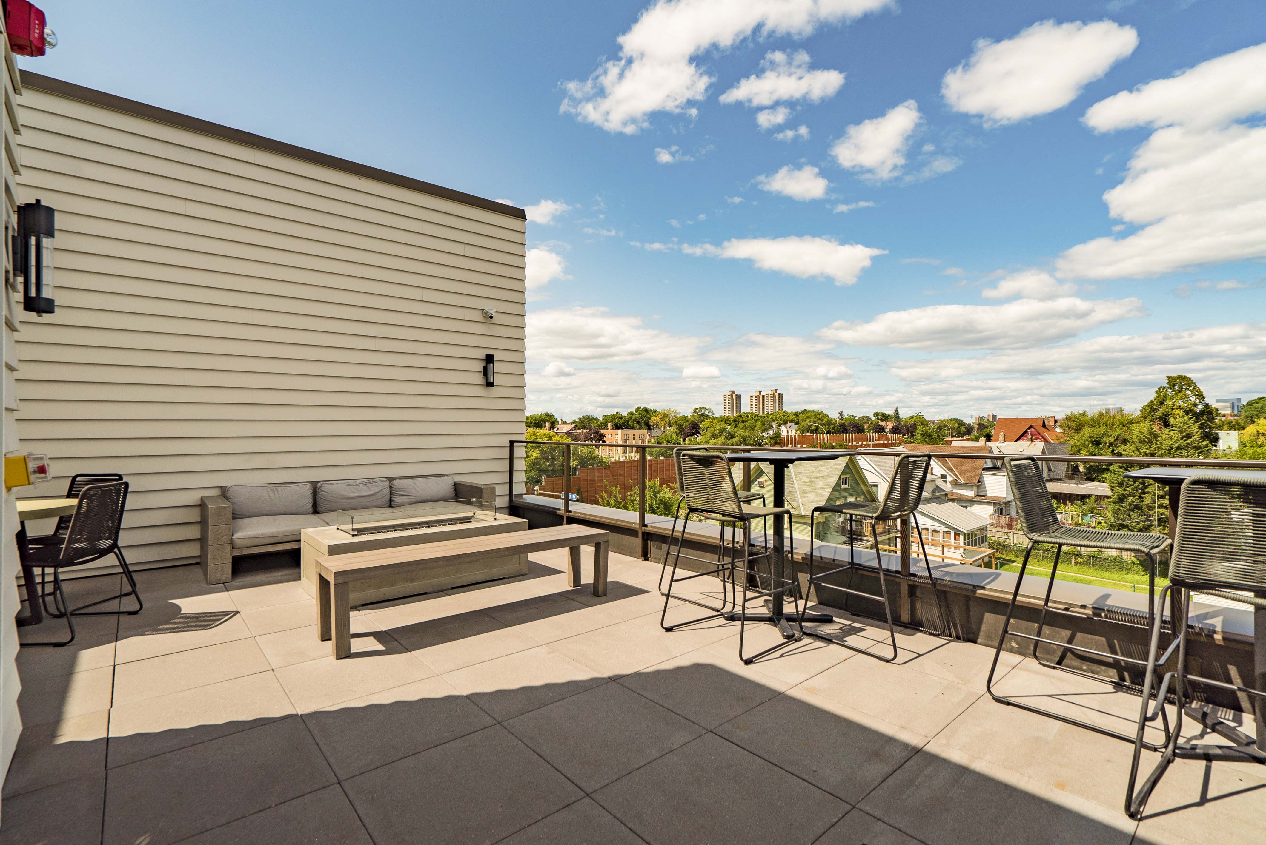 Rooftop patio and outdoor firepit at The Central apartments near downtown Minneapolis MN 55408