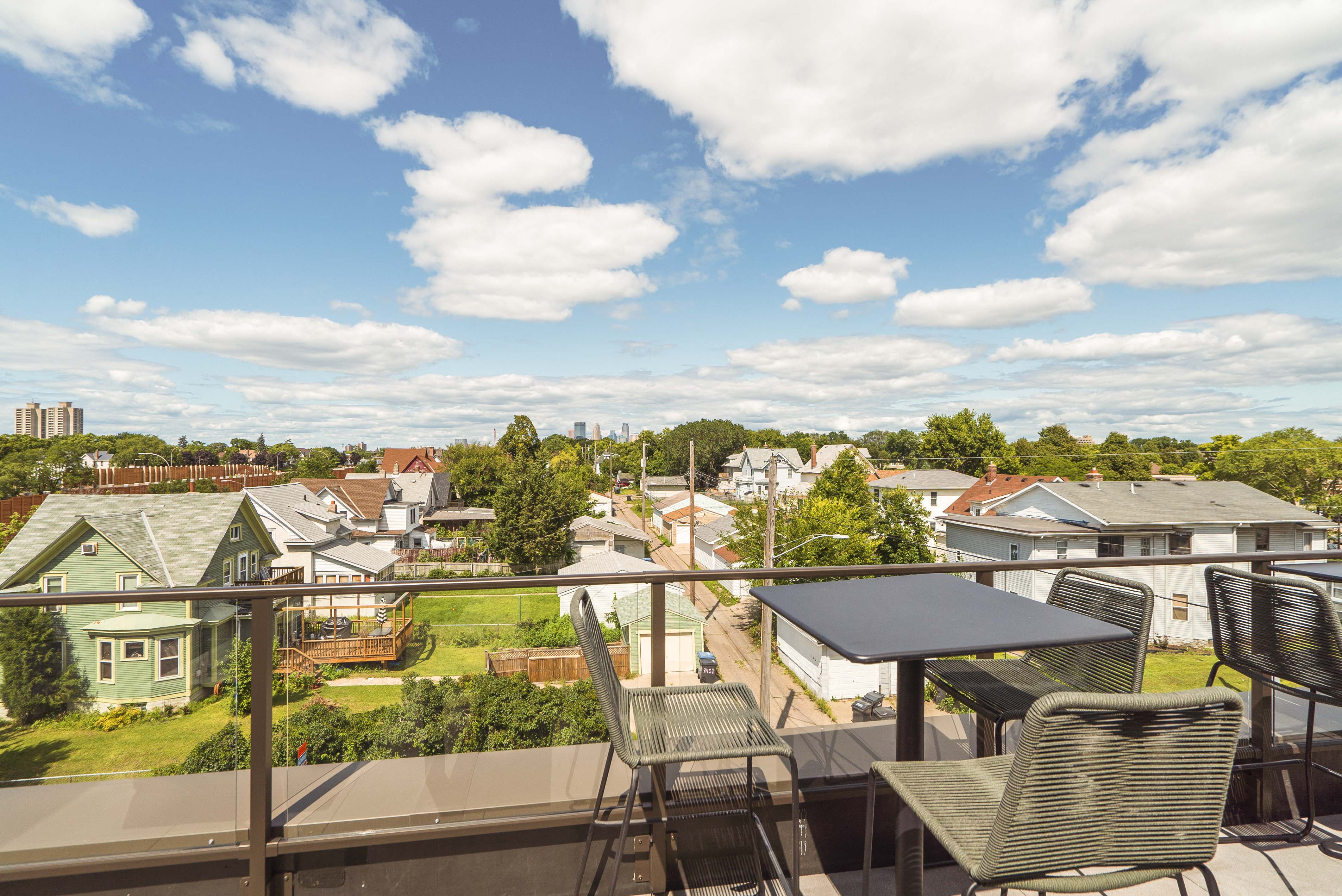 Scenic views from the rooftop patio and outdoor firepit at The Central apartments near downtown Minneapolis MN 55408