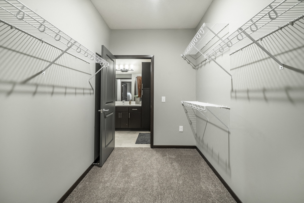 Spacious walk-in closet at The Conrad apartments in midtown Omaha NE