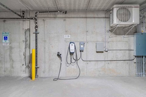 an EV charging station located in the parking garage