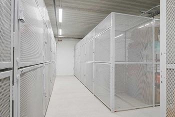 rentable metal mesh storage lockers in the parking garage