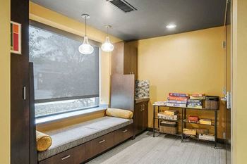 a pub room with built-in lounge/bench seating with board games