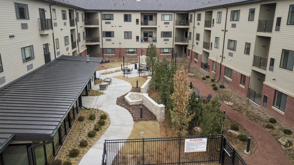 Private community park with pool, hot tub, firepits and outdoor grills at The Conrad in Omaha NE