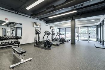 Fitness center with cardio and free weights at The Conrad near UNMC in the Blackstone District Omaha NE 68105