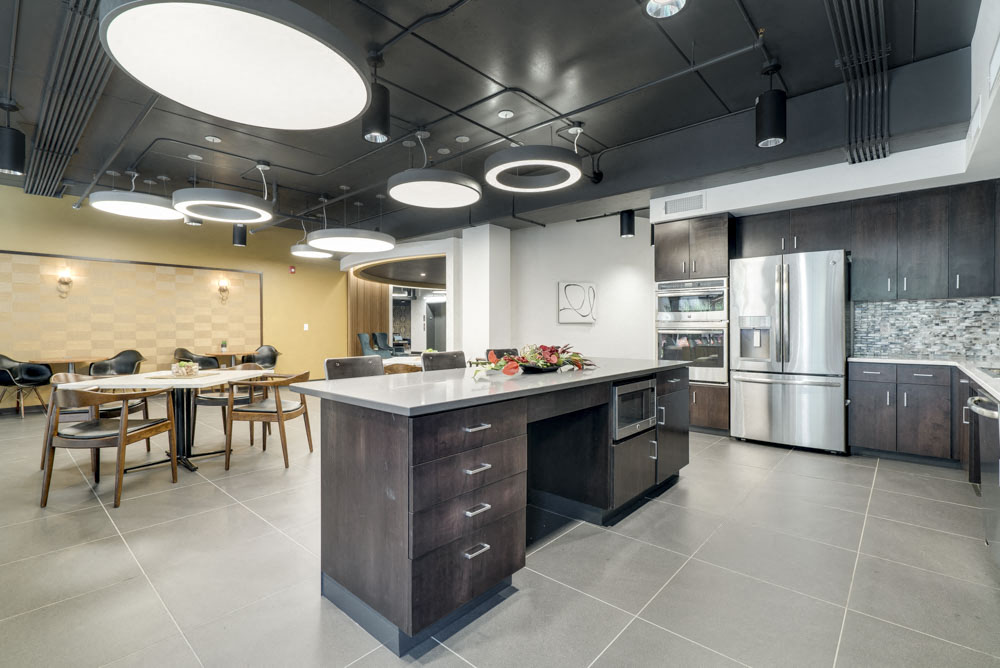 Clubhouse kitchen with chairs for studying at The Conrad near UNMC in the Blackstone District Omaha NE 68105