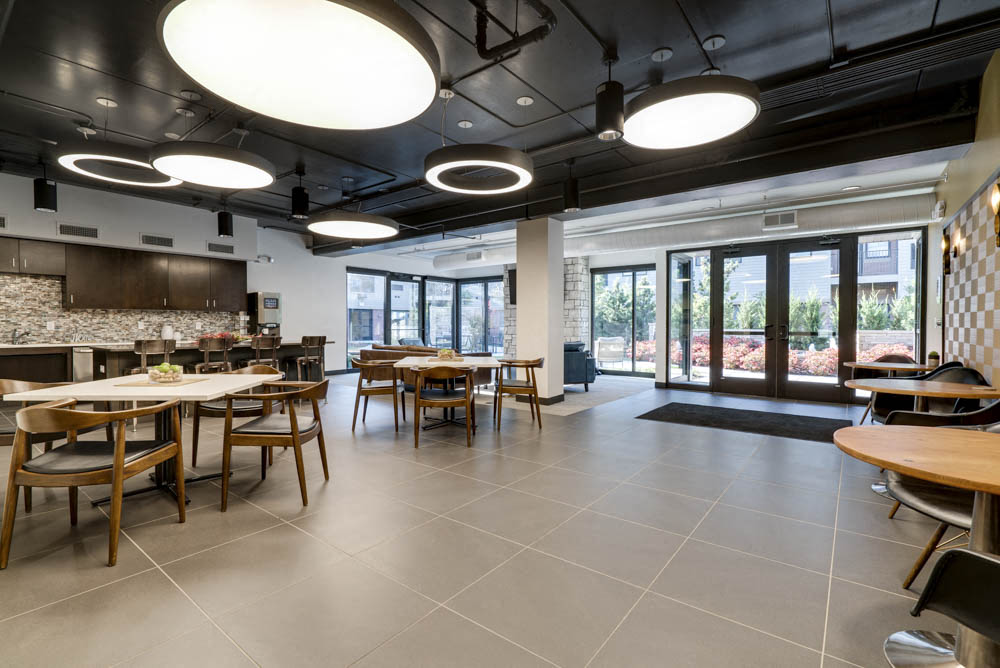 Clubhouse ktichen with view of pocket park at The Conrad near UNMC in the Blackstone District Omaha NE 68105