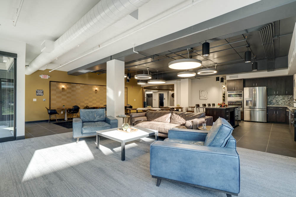 TV lounge view with additional seating at The Conrad near UNMC in the Blackstone District Omaha NE 68105