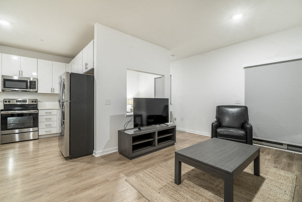 Studio apartment for rent with view of living room and kitchen in contemporary design near UNMC Omaha