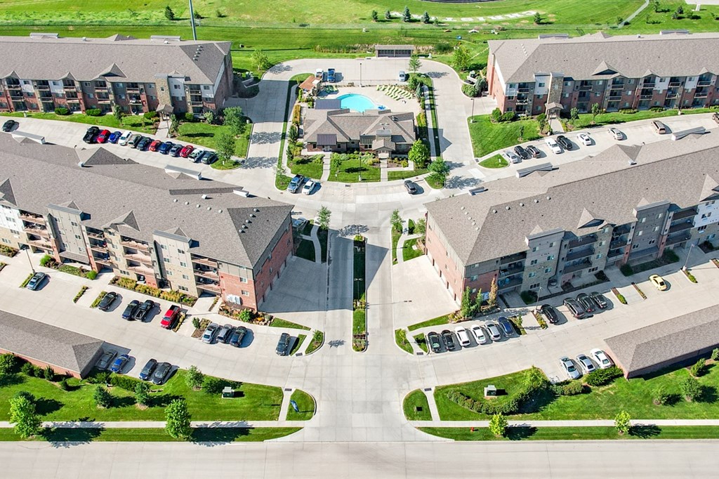 Arial view of the flats at 84 entrance with apartment buildings and swimming pool