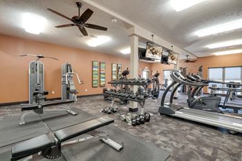 24-hour fitness center with weights and treadmills at The Flats at 84 in southeast Lincoln NE 68516