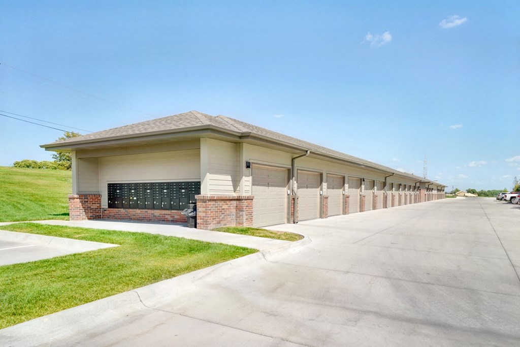 Row of garages and mailboxes on one end outside the Flats at Shadow Creek