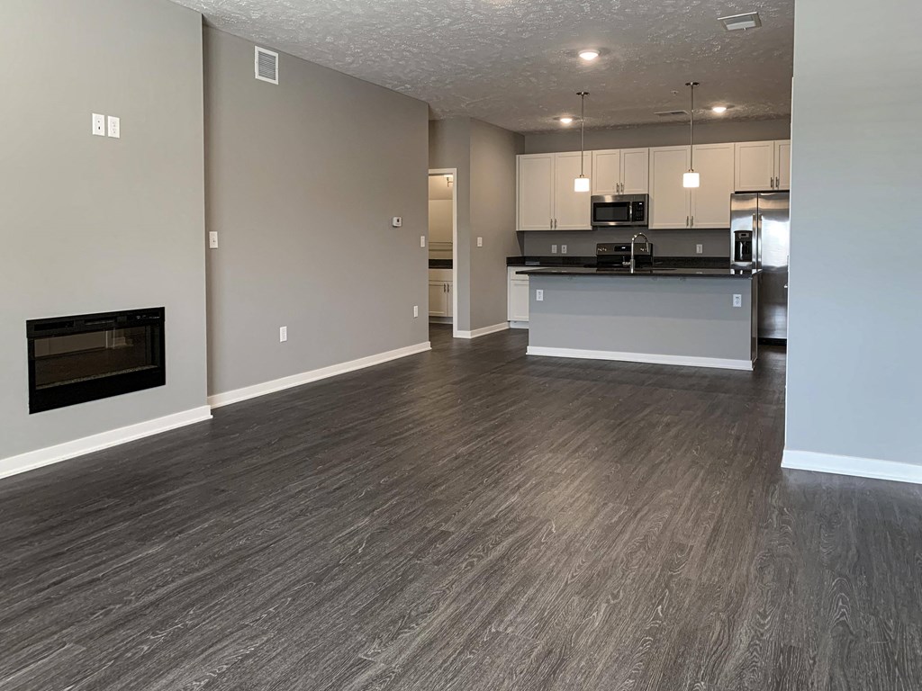 Living and dining area leading into the kitchen in the buffalo floorplan at the flats at shadow creek