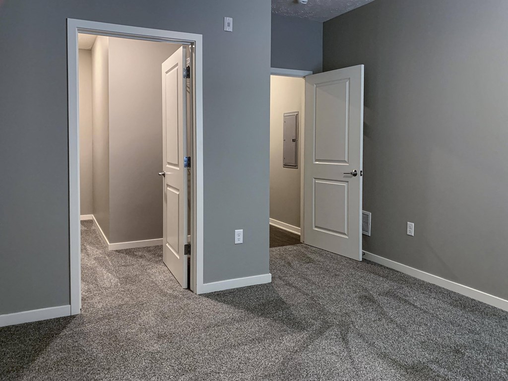 Bedroom with walk in closet access at the flats at shadow creek