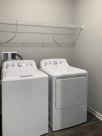 Washer and dryer closet with shelving space The Flats at Shadow Creek in Lincoln Nebraska