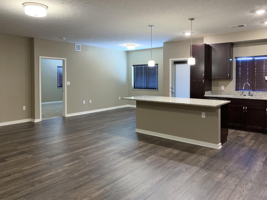 Large living and dining area with hardwood floors