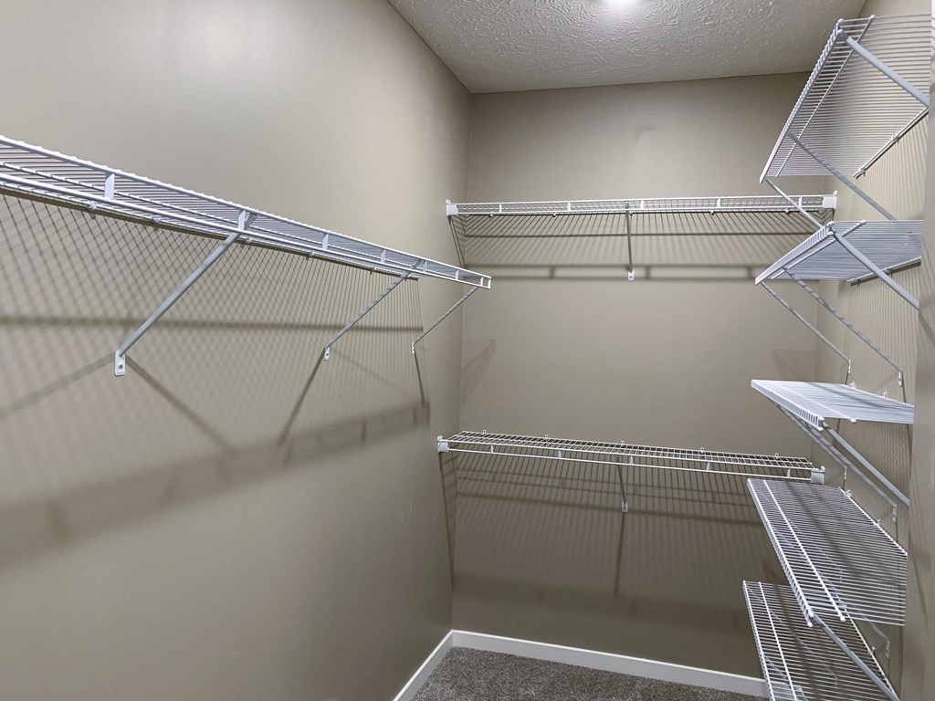 Walk in closet with plenty of shelving and hanging space