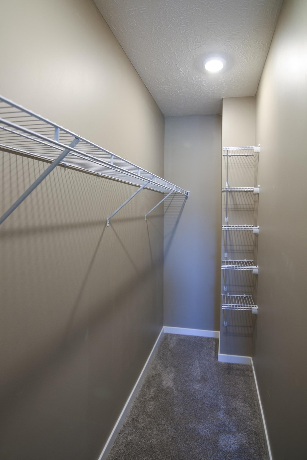 Walk in closet with extra shelving space