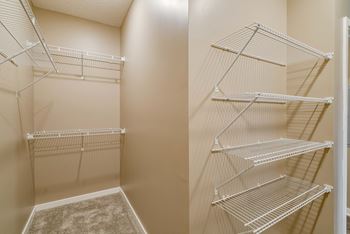 Walk in closet in master bedroom at The Flats at Shadow Creek new luxury apartments in east Lincoln NE 68520