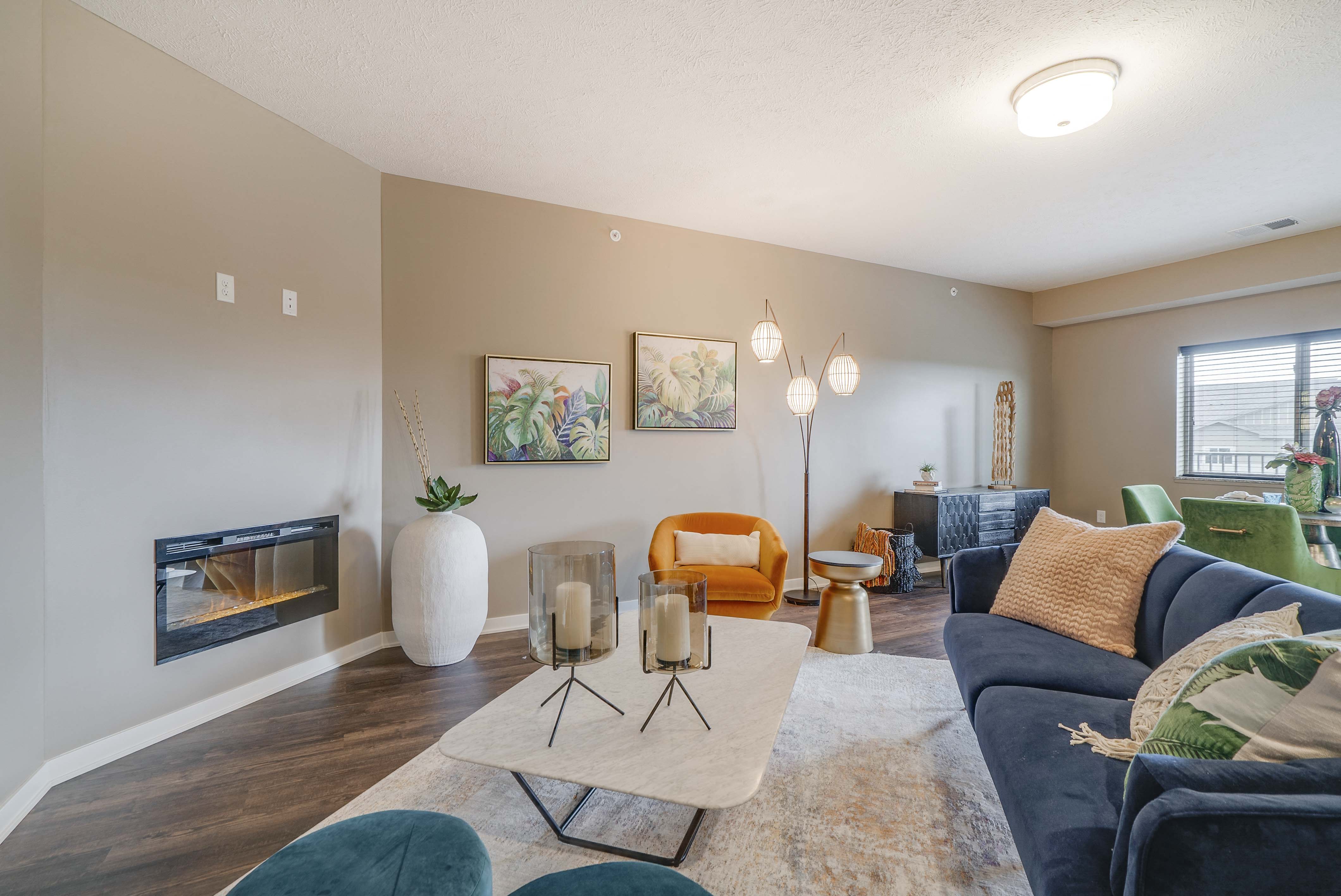 Spacious living room with modern fireplace at The Flats at Shadow Creek new luxury apartments in east Lincoln NE 68520