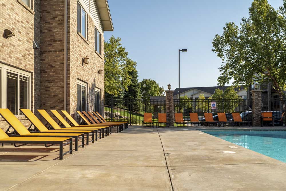 Poolside reclining lounge seats  at Grand Legacy apartments and townhomes in west Omaha NE 68130