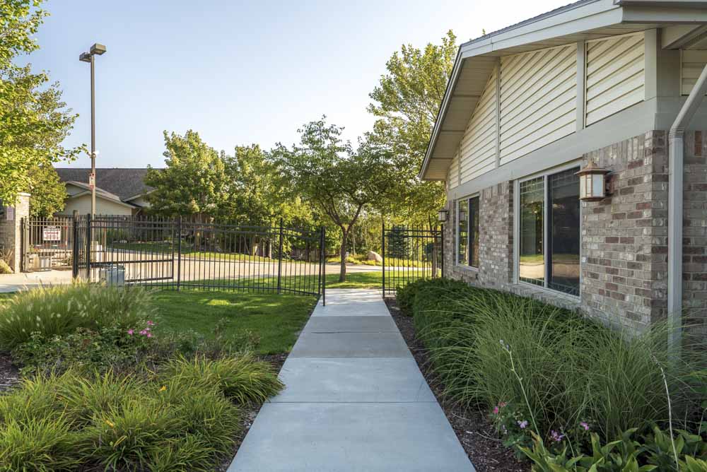 Gated entrance to Grand Legacy apartments and townhomes in west Omaha NE 68130