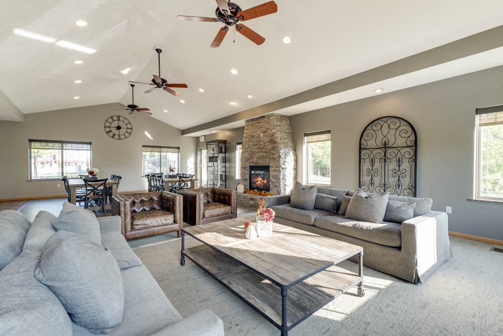 Clubhouse with social spaces and comfortable couches at Grand Legacy apartments and townhomes in west Omaha NE 68130
