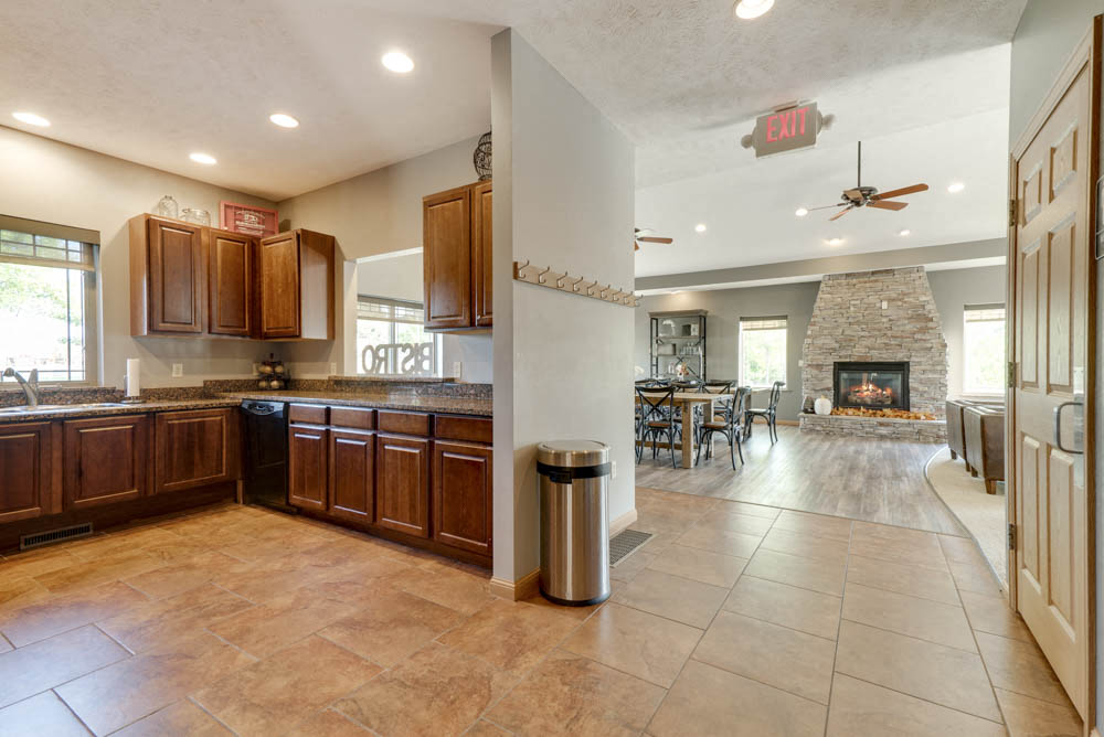Kitchen and great room in clubhouse  at Grand Legacy apartments and townhomes in west Omaha NE 68130