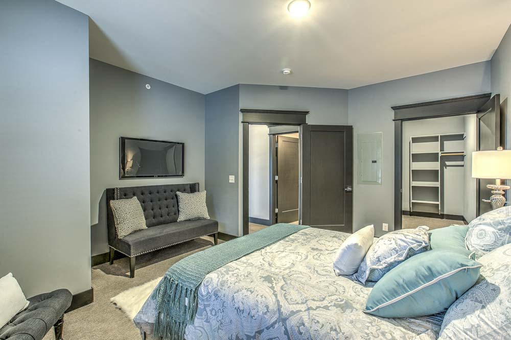 Large open floor plan bedroom with large walk in closet